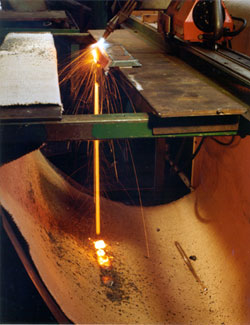 Welding steel with our Weld Stop Fabric beneath, catching the molten metal and sparks